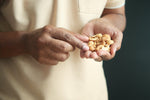 man eating cashews