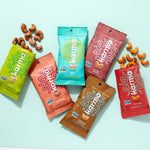 a variety of cashew snacks on an aqua background 